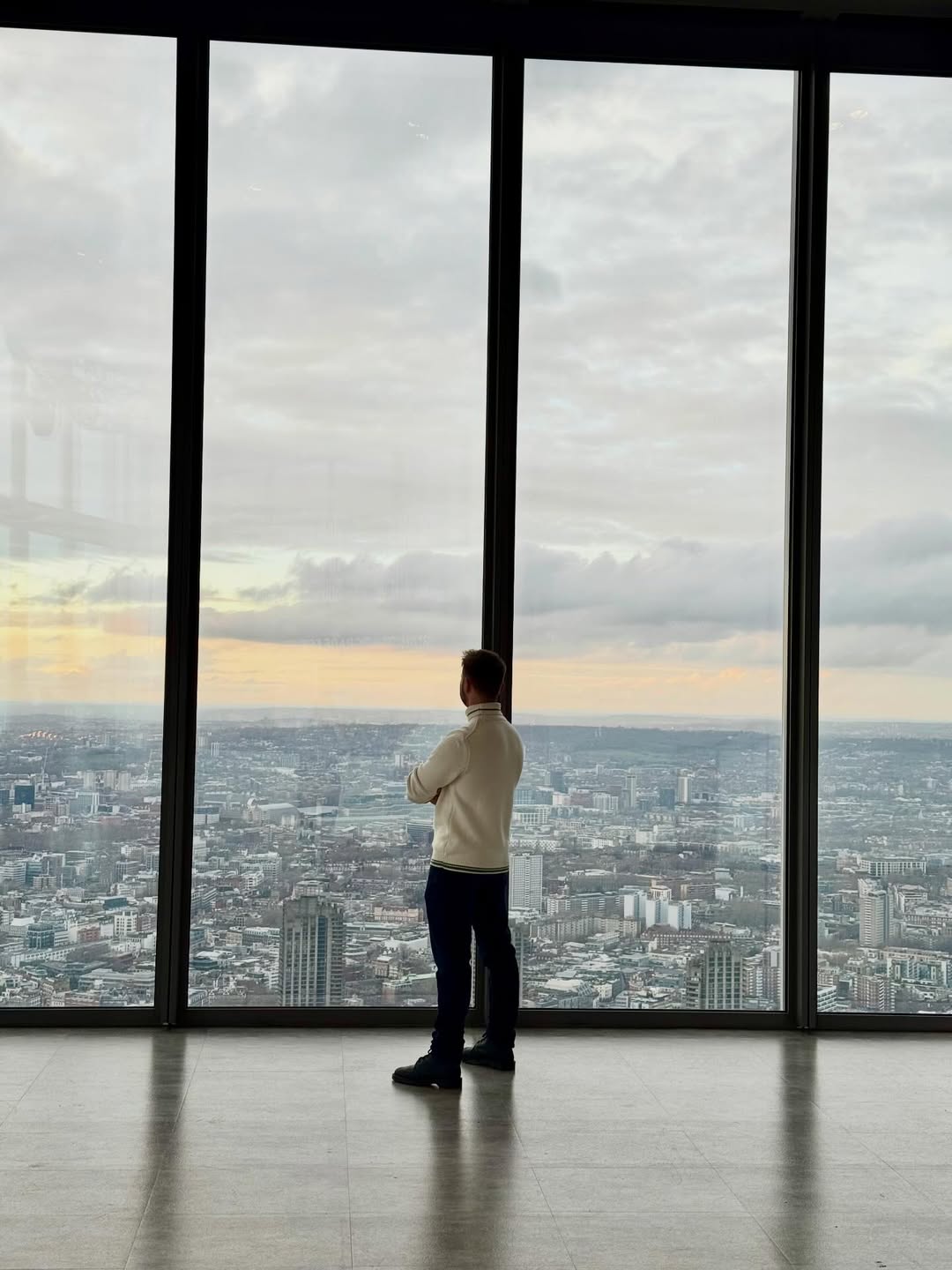 Artūras looking over a city skyline